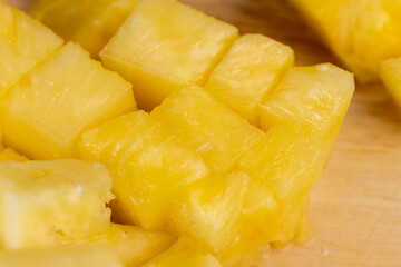 Sliced into pieces of fresh ripe peeled pineapple