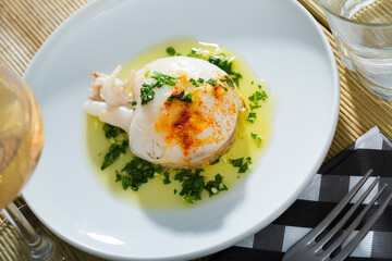 Fried cuttlefish served with green olive oil sauce with garlic and parsley