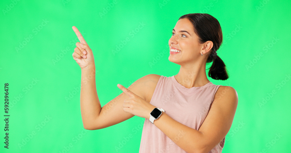 Canvas Prints Woman face, hands pointing and green screen with happiness and smile showing advertisement. Portrait, isolated and studio background with a happy young female point to show mock up announcement