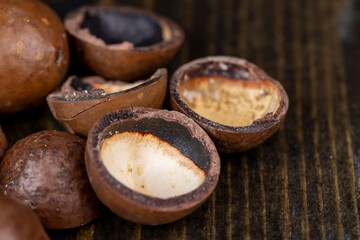Unpeeled macadamia nuts on the table