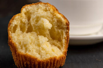 Soft and fresh fragrant wheat cupcake on a black stone