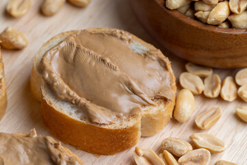 Peanut paste on a soft wheat baguette