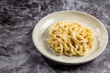 Delicious fettuccine pasta with white cheese sauce. Fettuccine pasta with Alfredo sauce.