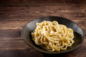 Delicious fettuccine pasta with white cheese sauce. Fettuccine pasta with Alfredo sauce.