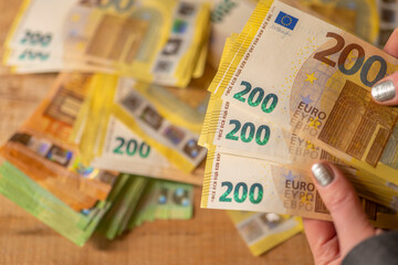  Recalculation of money.200 euro banknotes. Counting euro banknotes.Hands recalculate banknotes.incomes in European countries.pack of money in a hand close -up.