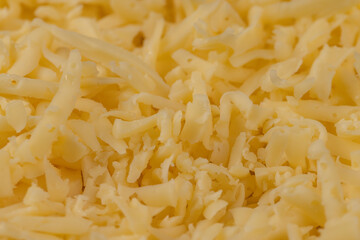 Hard cheese with holes grated into thin small slices