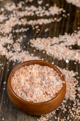 Pink natural salt on the table, close up