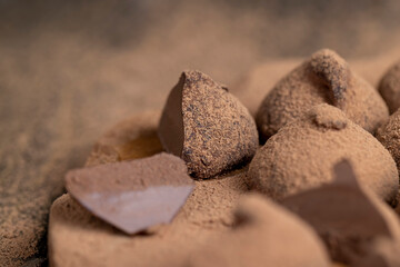 a large number of sweet candies in chocolate powder