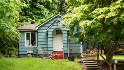 blue suburban cottage townhouse property. photo of suburban cottage townhouse.