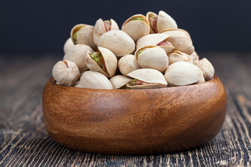 peeled pistachio nuts close-up on the table
