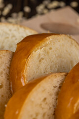 Wheat baguette on a wooden cutting board