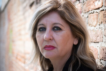 Fototapeta premium Pensive thoughtful middle aged woman looking away.