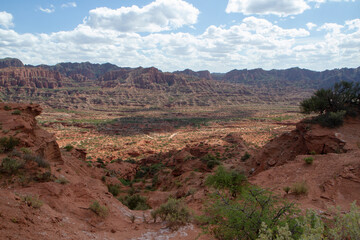 Prehistoric cliffs in Sierra de las Quijadas National Park. Arid desert landscape. Red sandstone, hills, canyon and valley view.