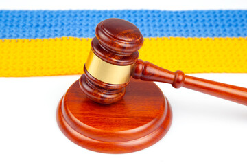 gavel of justice on the background of the Ukrainian flag