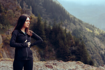 Female Runner Feeling in Pain after Exercising Hard. Exhausted jogger feeling side stitches during outdoors workout
