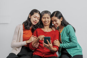 Mother's day, woman birthday anniversary, Senior elderly mature asian millennial grandmother with female daughter only women three people twin grand sister and young sister, real family person.