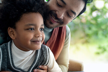 Obraz premium Happy father with small son, spending time at home together, single dad concept, Father's Day
