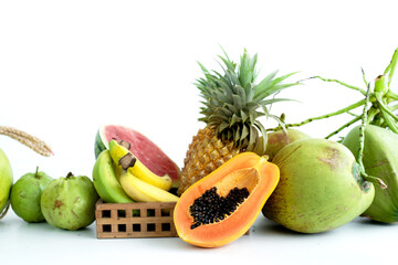 Tropical fruits on a white background, fresh fruits and on white table, assorted seasonal tropical fruits