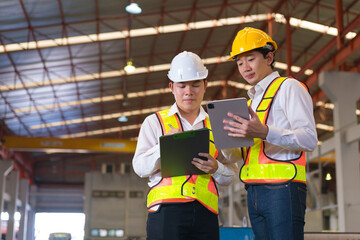 Professional industry engineer worker in a metal manufacture warehouse , maintenance service check for safety first concept .