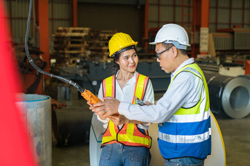 Professional industry engineer worker in a metal manufacture warehouse , maintenance service check for safety first concept .