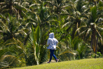 Jogging in the rainforest. Outdoor sports. Jungle.