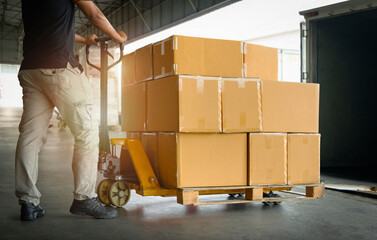 Workers Unloading Package Boxes on Pallets in Warehouse. Cargo Delivery Load with Shipping...