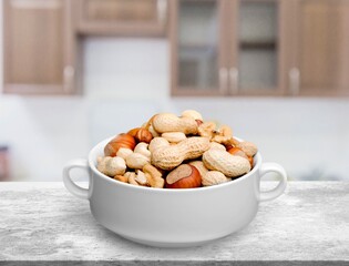 Set of tasty healthy nuts on the desk