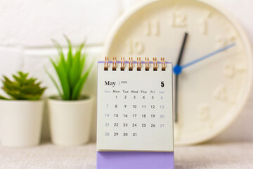 Calendar for May 2023 on the desktop for managing and planning every day. - obrazy, fototapety, plakaty