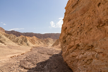 Golden Canyon trailhead with scenic view of colorful geology of multi hued Amargosa Chaos rock formations, Death Valley National Park, Furnace Creek, California, USA. Barren Artist Palette landscape