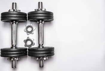Two dumbbells on a white background.