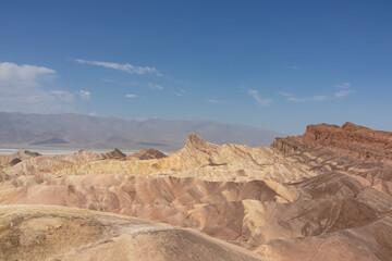Scenic view of summit peak Manly Beacon seen from Zabriskie Point, Badlands, Furnace creek, Death Valley National Park, California, USA. Erosional landscape of multi hued Amargosa Chaos rock formation