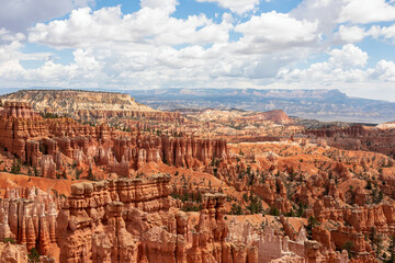 Scenic aerial view of massive hoodoo sandstone rock formation towers on Navajo trail in Bryce Canyon National Park, Utah, USA. Natural unique amphitheatre in summer. Dark clouds emerging to storm
