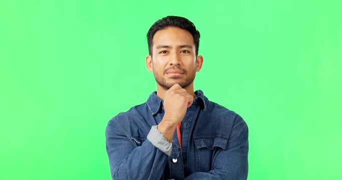 Face, thinking and man with idea in green screen studio and nodding, deciding or planning. Contemplating, portrait or puzzled asian guy with decision, choice or solution on isolated mockup background