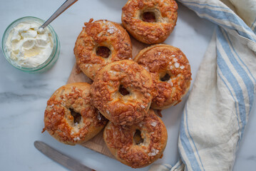 home made whople grain Bagels with cheese on a table