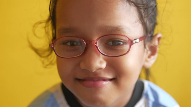 portrait of a child in new glasses.