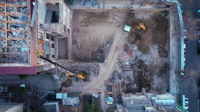 Heavy equipment is dismantling the building