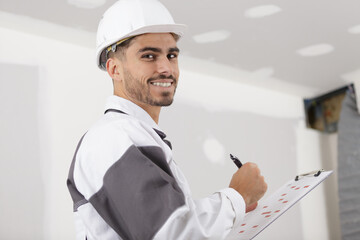a builder in with clipboard