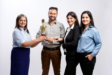 Young successful businessman or employee receiving award with support staff.