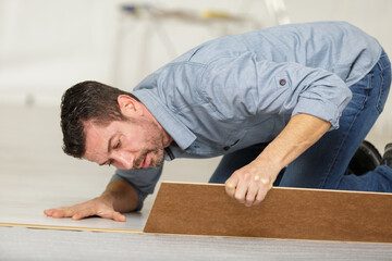 a man during flooring installation