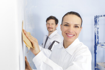 a happy woman grinding wall