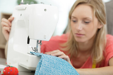 woman working with a sewing machine