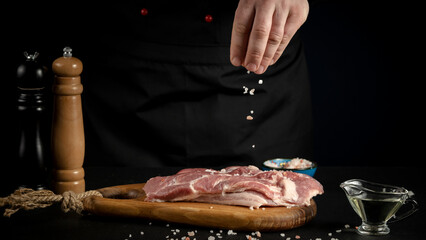 a man adds spices to meat