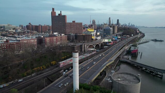 Industrial looking clip of NYC's Hudson Highway, traffic to and from downtown Manhattan in early evening.