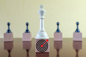 Business target,objective and achievement concept., Selective focus on king chess on wooden cube...