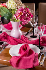 Table decorations in Marsala color. Wedding table served for dinner. Design in a Rose-red tones. Close-up. Textured