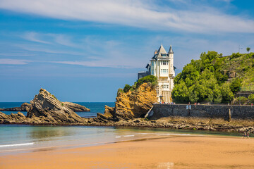 Villa Belza and rocks of the Cote des Basques beach in Biarritz, France on a summer day - obrazy, fototapety, plakaty