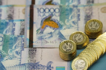 Almaty, Kazakhstan - 04.05.2023 : Coins and banknotes of Kazakhstani tenge are laid out on the table.