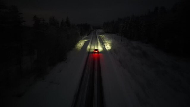 Driving on a snowy road at night in Finland