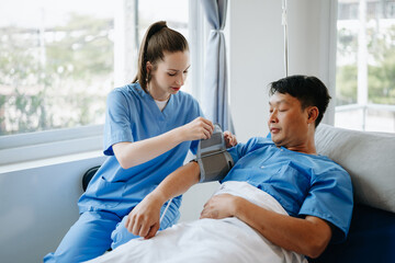 Fototapeta premium Caucasian doctor smiling take care of a young patient in hospital. Friendly nurse or therapeutic treat client Professional medical service concept.