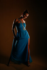 Girl on fashion photoshoot. Dimmed lights